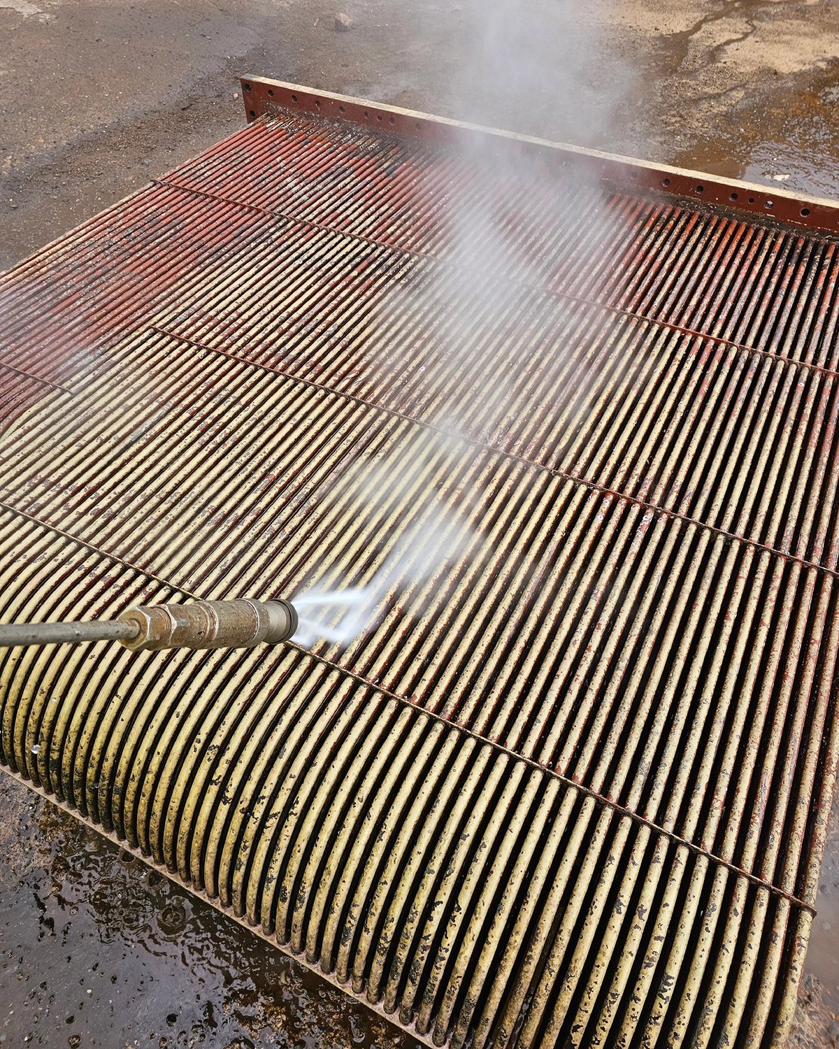 Pressure washing box coolers at Dales Marine